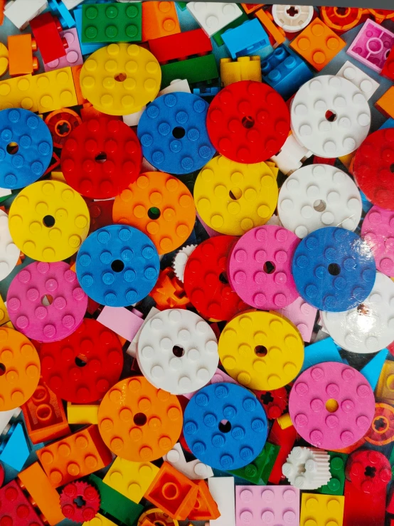 a pile of multicolored legos are laying together