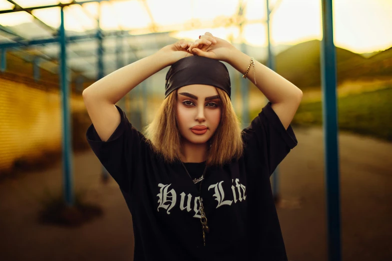 a woman holding her hat with one hand