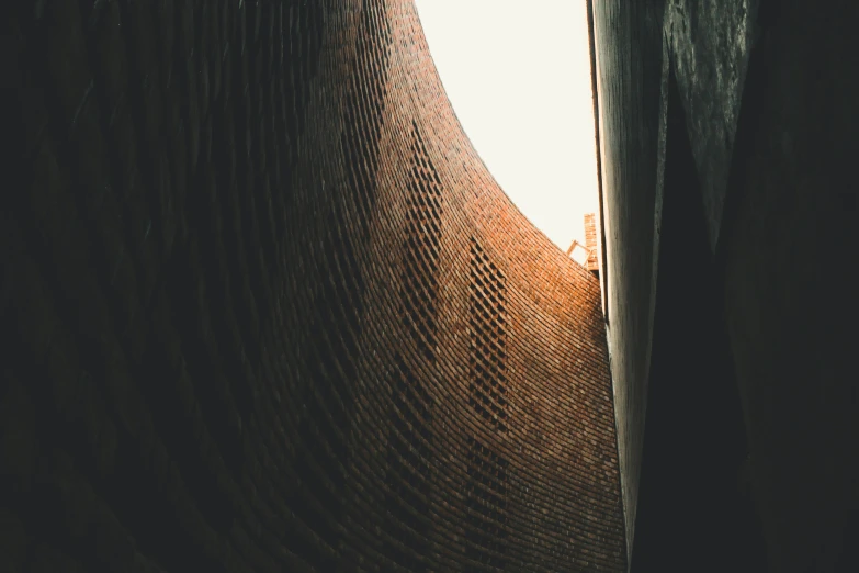 a brick wall near an open doorway in a building