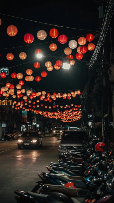 a street filled with lots of red lanterns