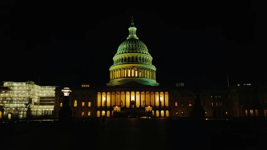 the dome and building are lit up at night