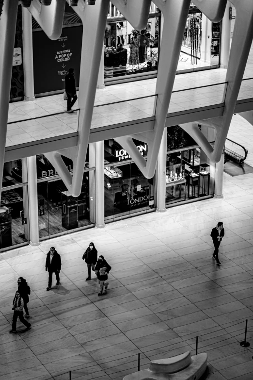 people are walking around inside of a building