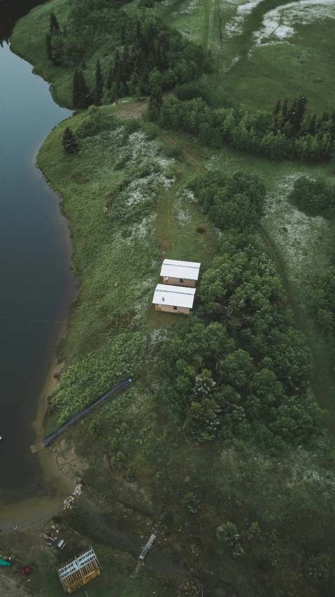 an aerial view of several boats docked at a shore