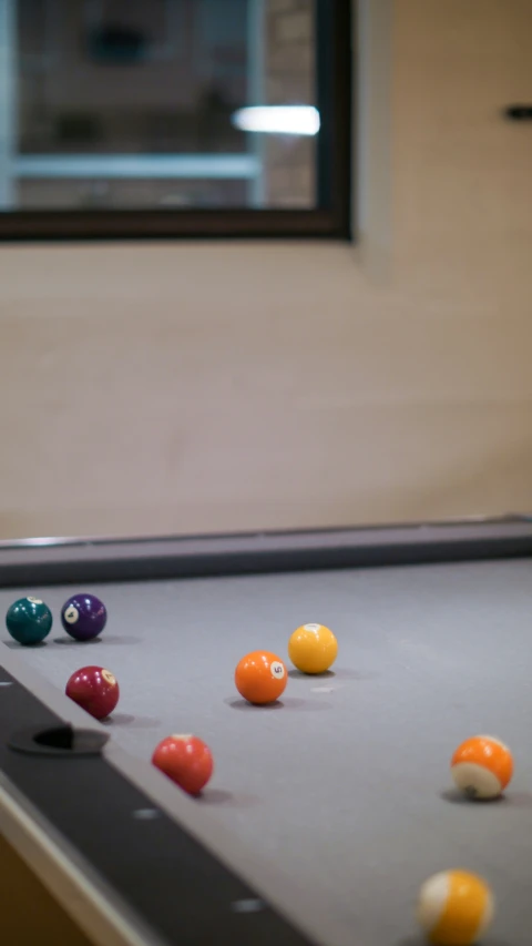 eight ball balls laid out on the table