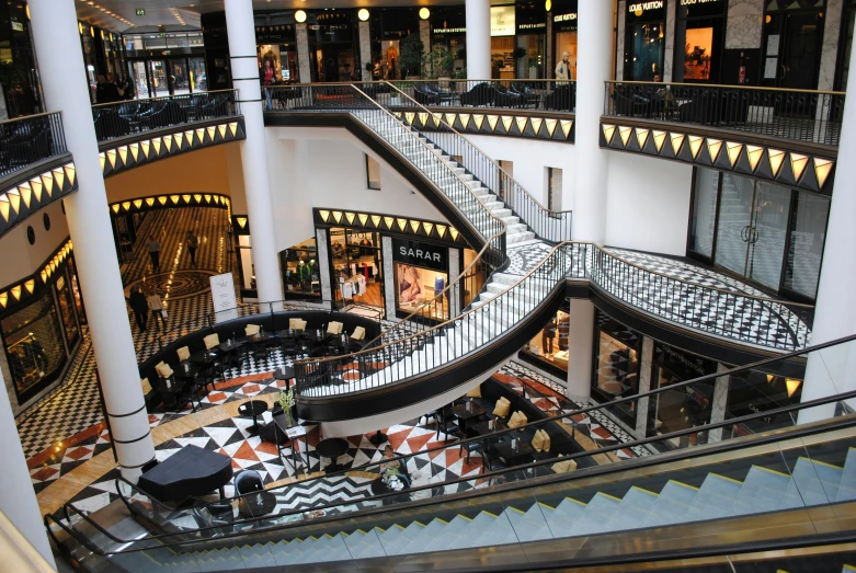 an interior image of a building with spiral staircases and black and white checkered tiled floors