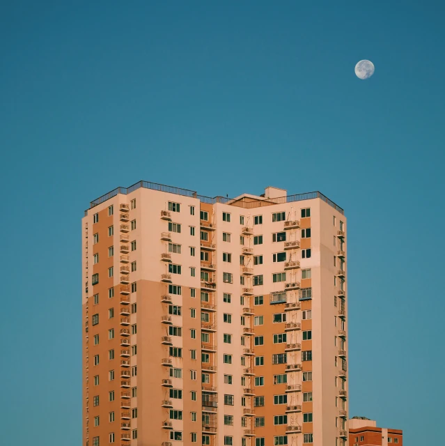 the top of an apartment building, with two stories up and three story down