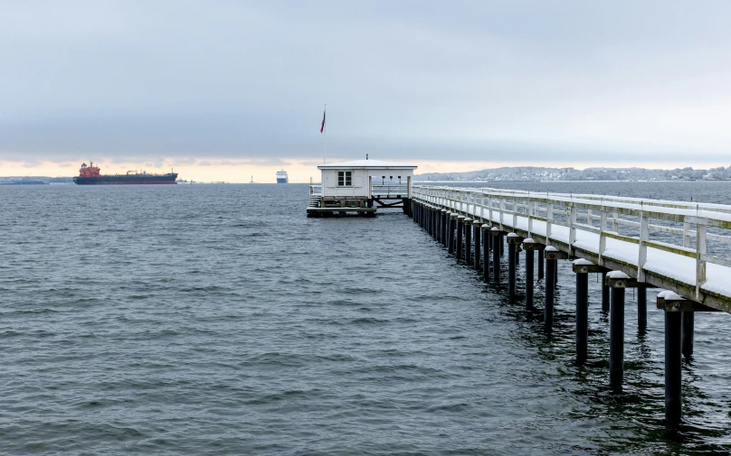 a pier stretching over the water and into the ocean