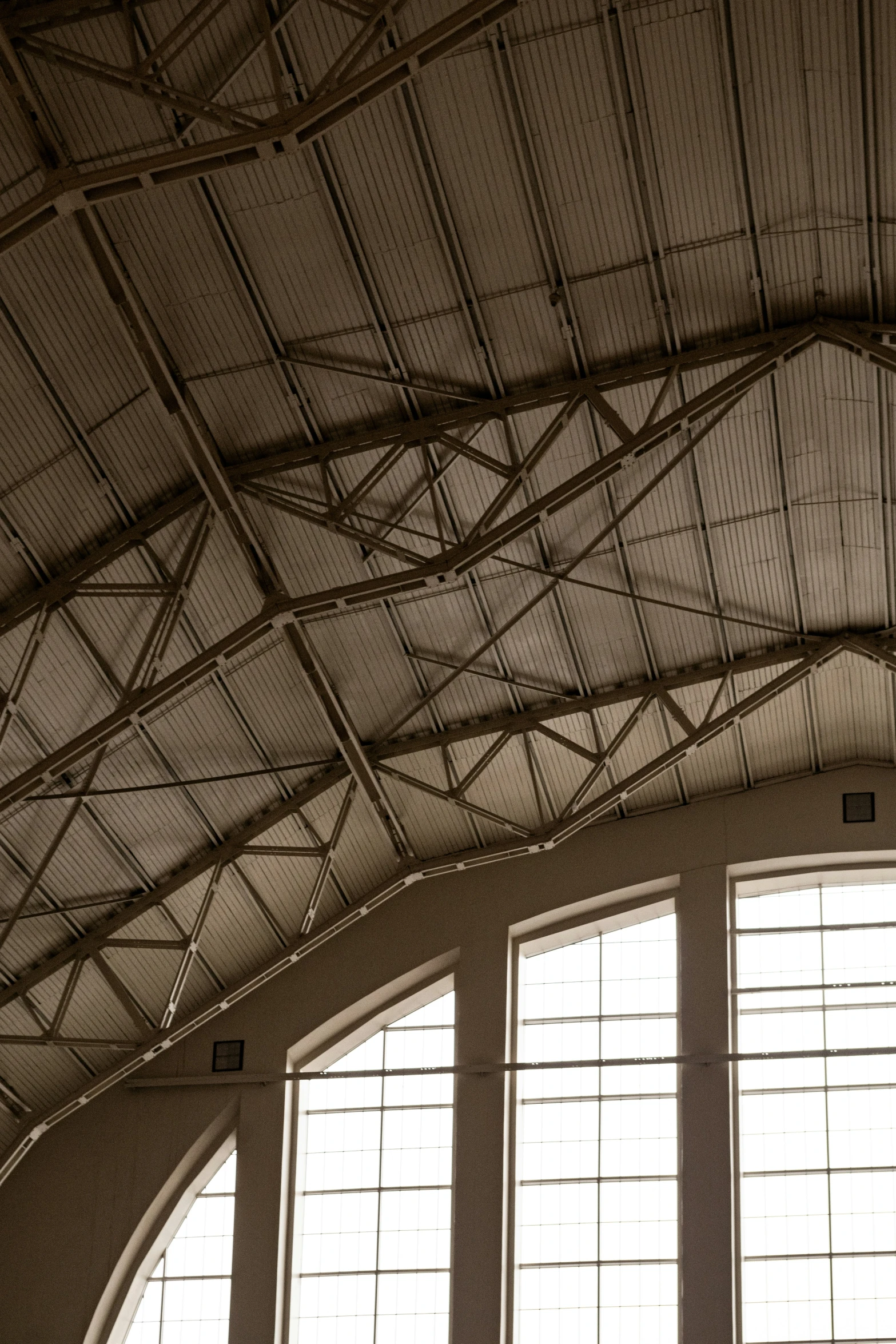 a view from inside of an empty building with two windows