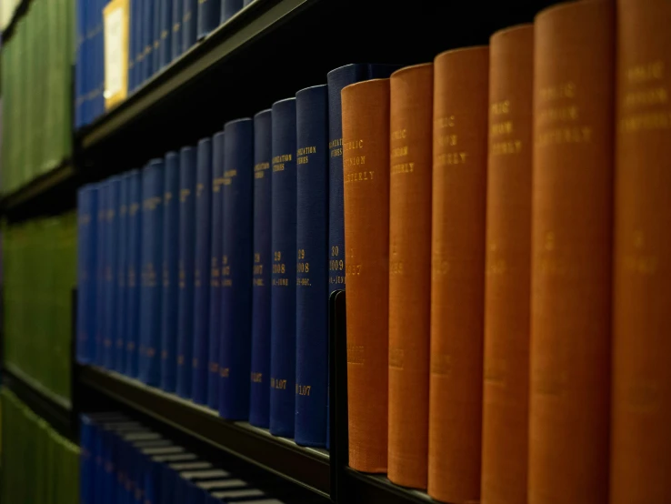 many books on a bookshelf in an office