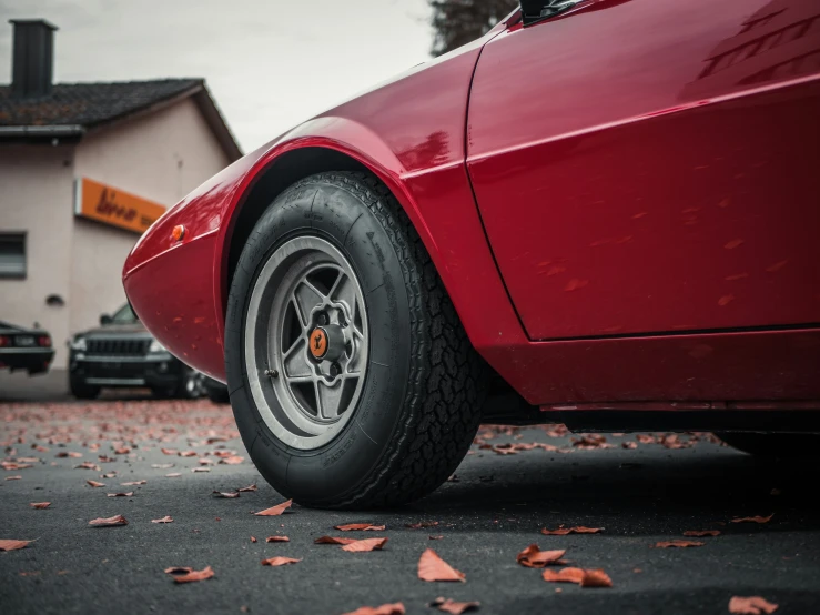 a red sports car parked on a city street