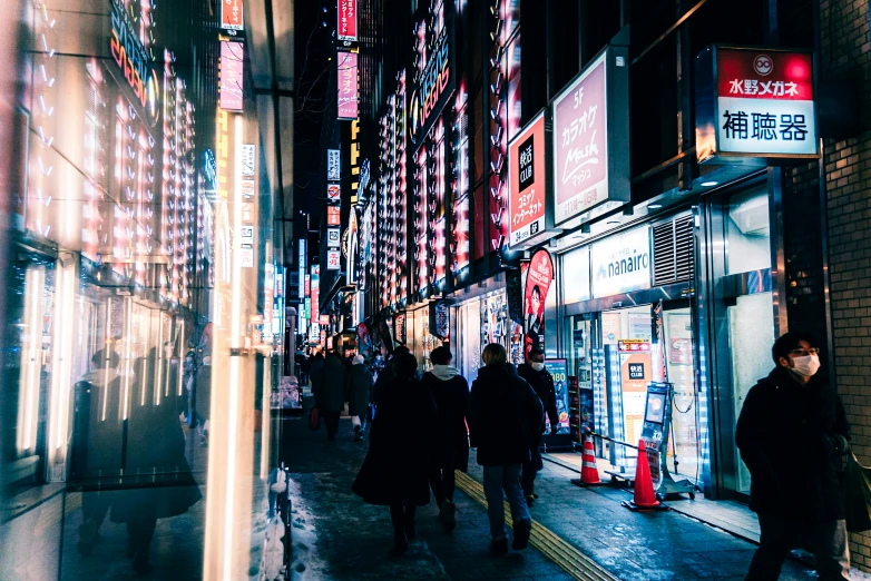 a group of people that are walking down a sidewalk