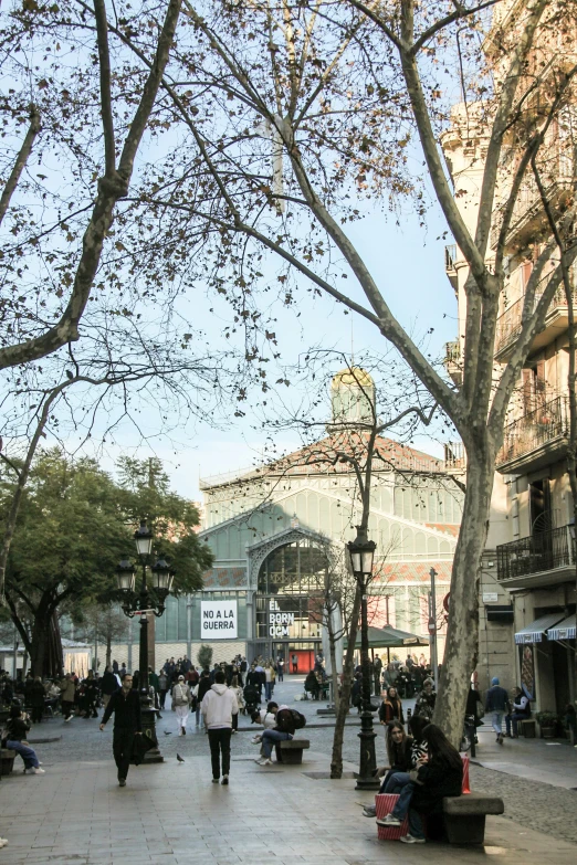 people are walking in a busy sidewalk with no one sitting or standing