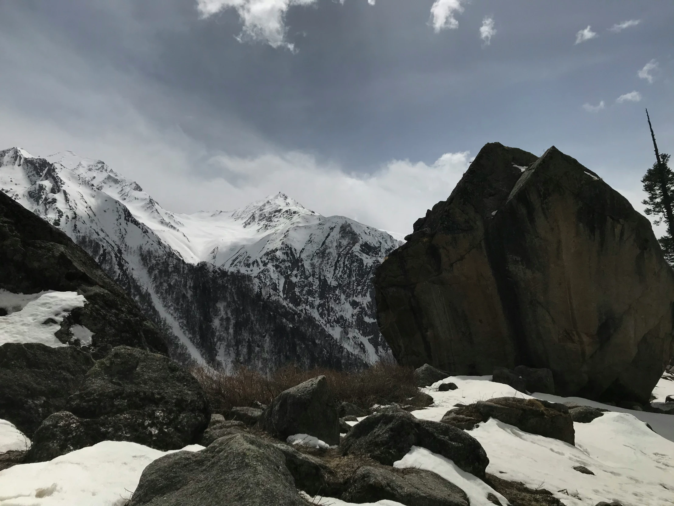 there are two snow covered mountains that can be seen from the ground