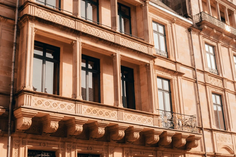 a building that has lots of windows and balconies on it