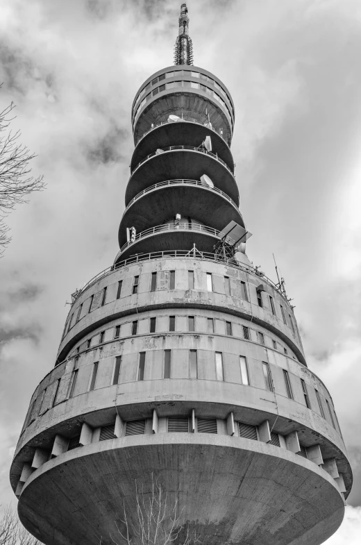 a very tall building with a round tower