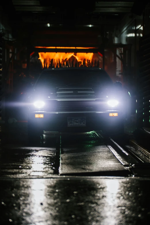 car moving down dark road at night time