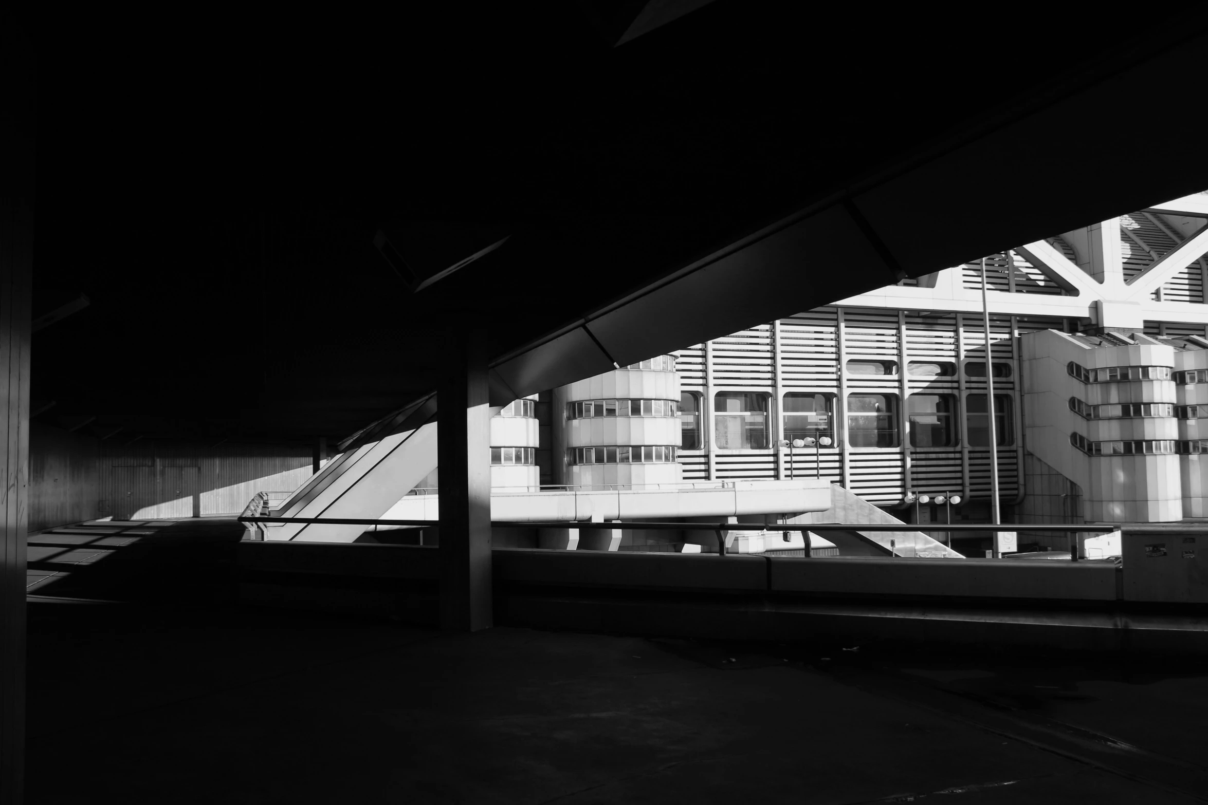 black and white pograph of building reflection in window