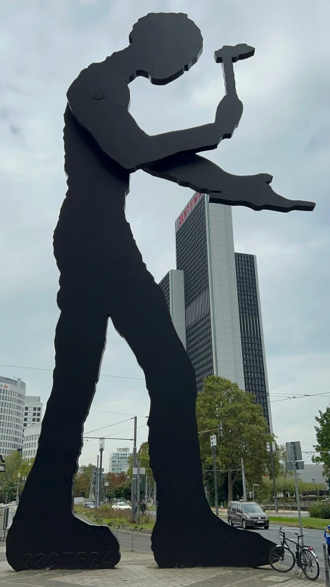 a sculpture of a person with a hammer