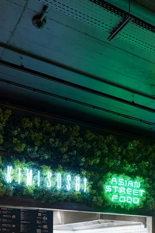 the restaurant has plants growing from the wall