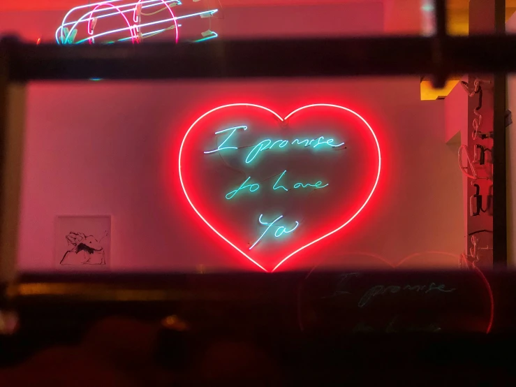 some kind of neon writing that is above some lights