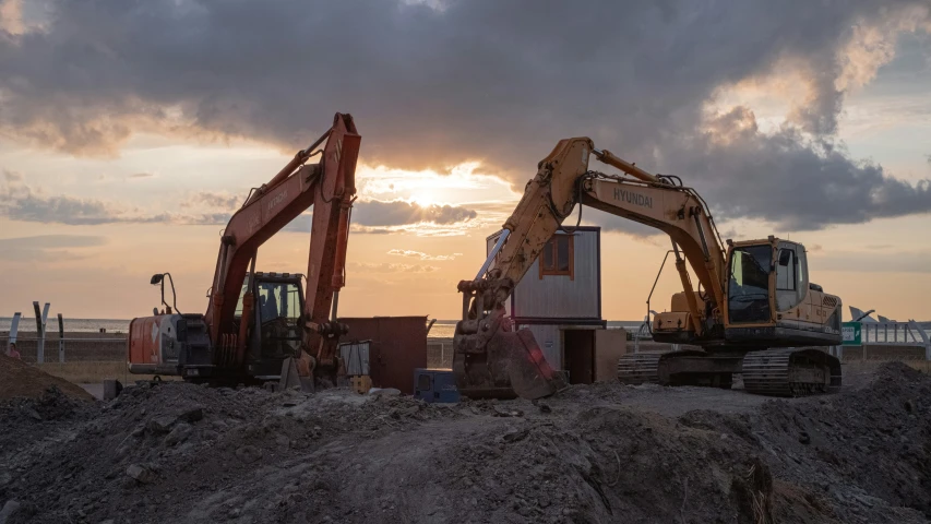 two large machines sit on the ground