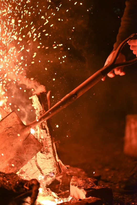 a person with a spatula is cooking soing