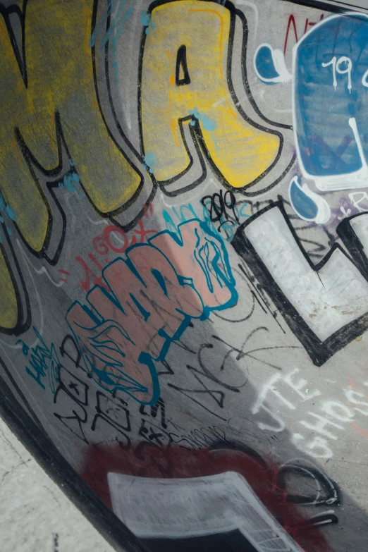 a man on skateboard that is covered in grafitti