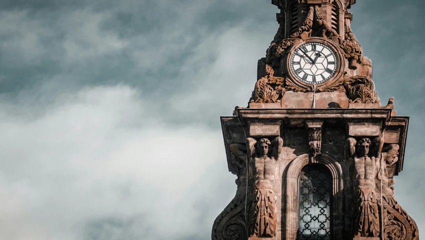 there is a large clock tower that has clocks