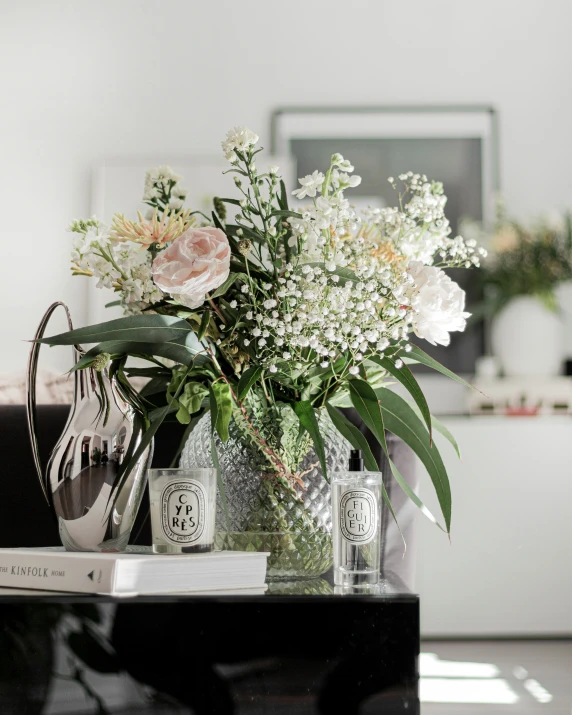 a vase of flowers sitting on top of a table