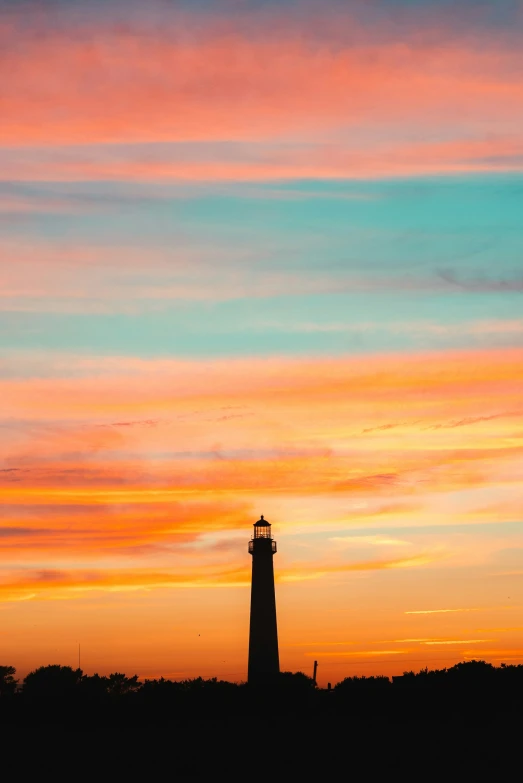 the silhouette of an airplane is seen against a sunset sky