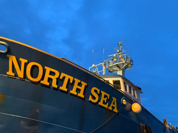 a large fishing vessel sitting in the water