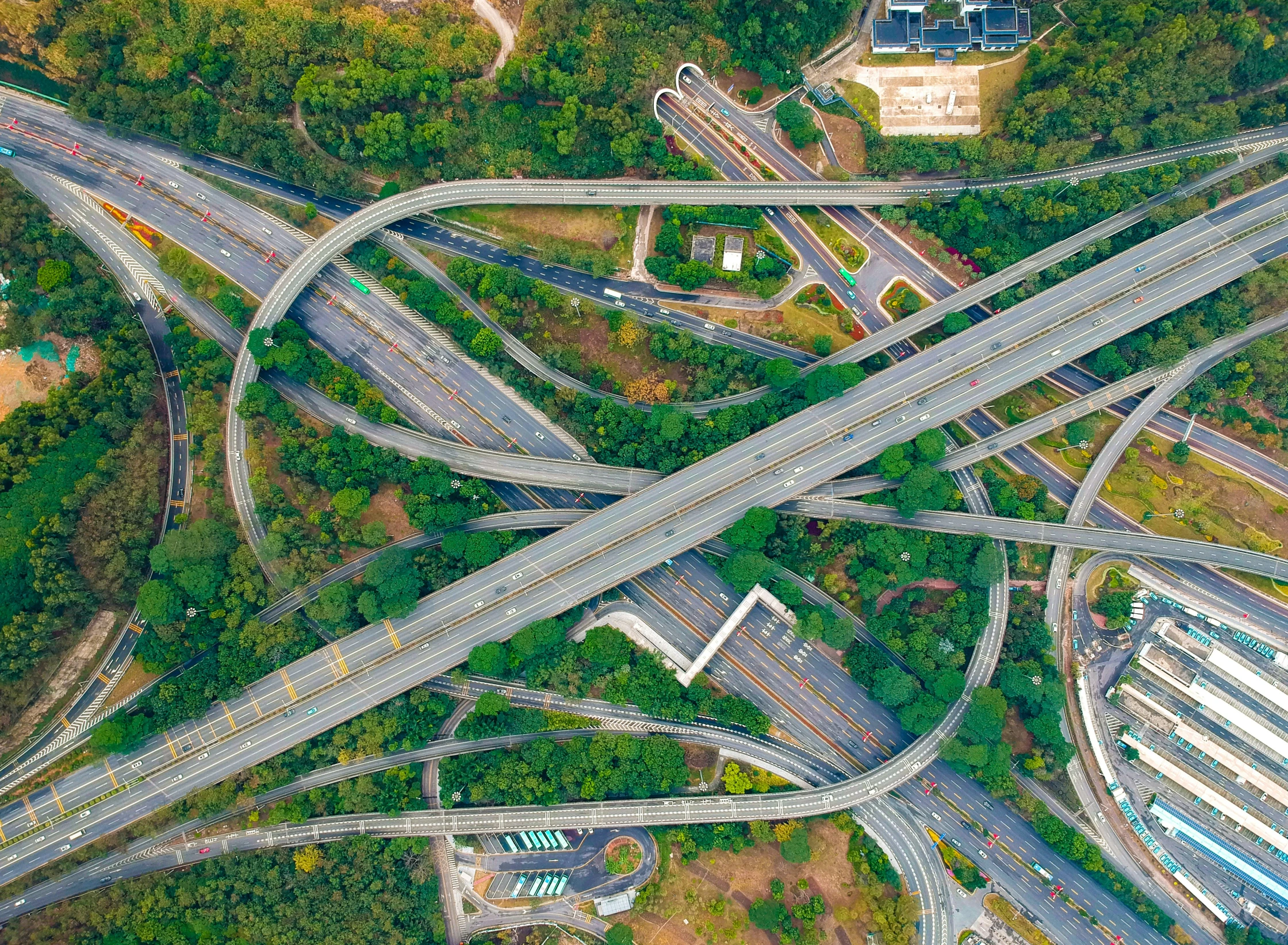 an aerial view of a highway intersection with multiple lanes and traffic