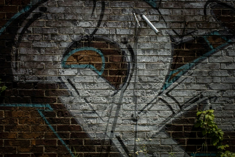 graffiti on a brick wall in an urban area