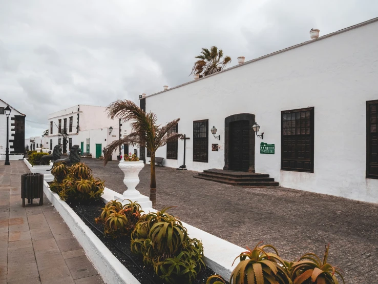 a white building on the side of a road