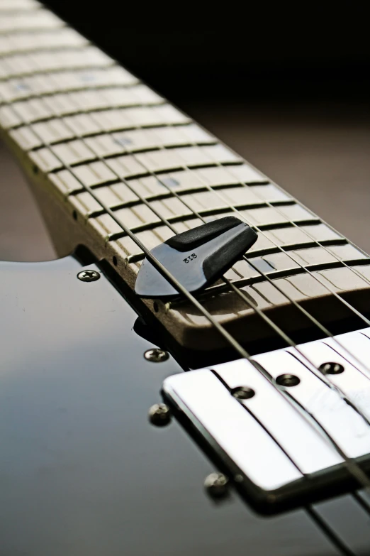 closeup of a guitar that is being used to play music