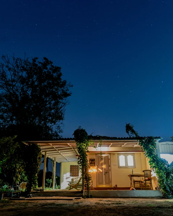 a home is lit up by lights at night