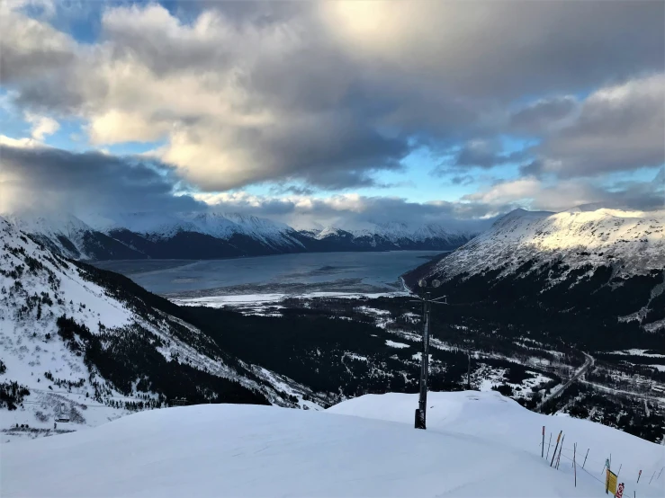 the ski slope has snow on it and mountain views