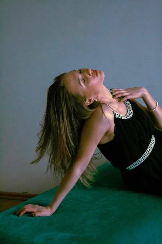 a woman is stretching out on a mat