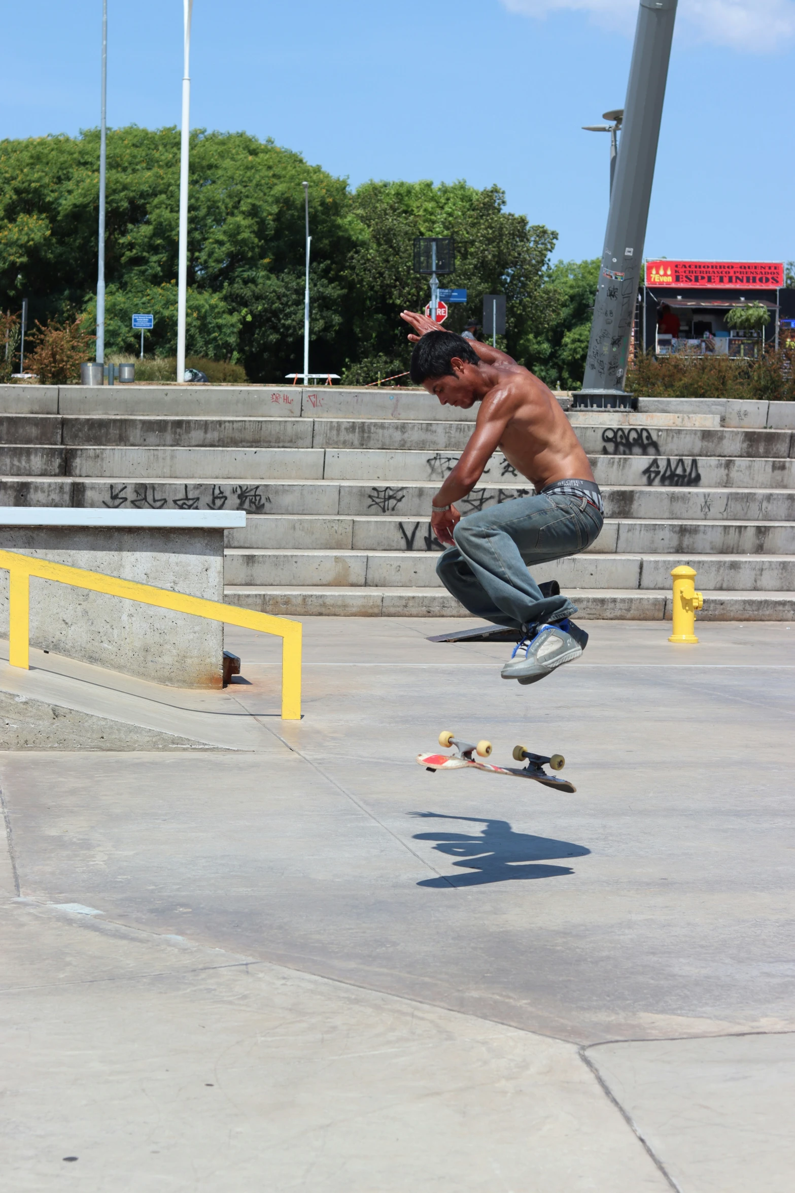 a man is in midair doing a jump on his skateboard