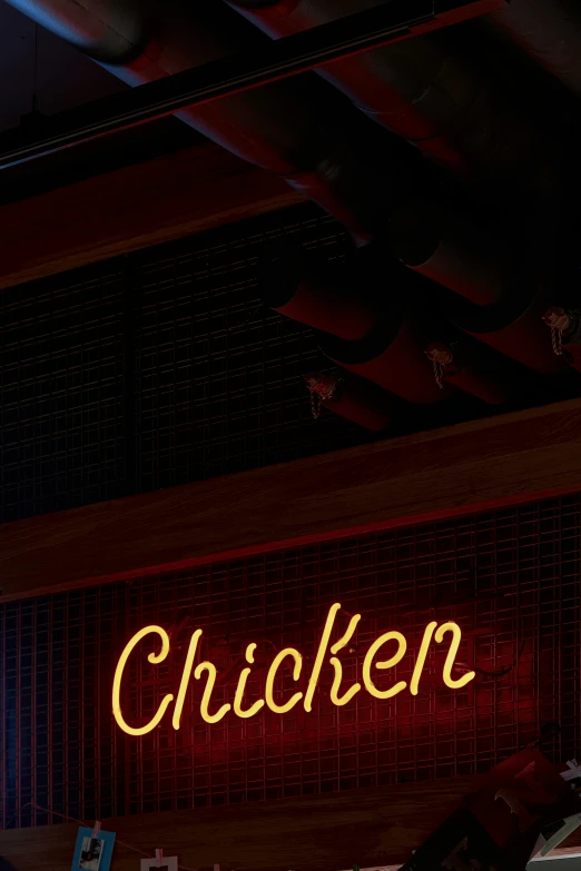 the word chicker lit up on the wall of the restaurant
