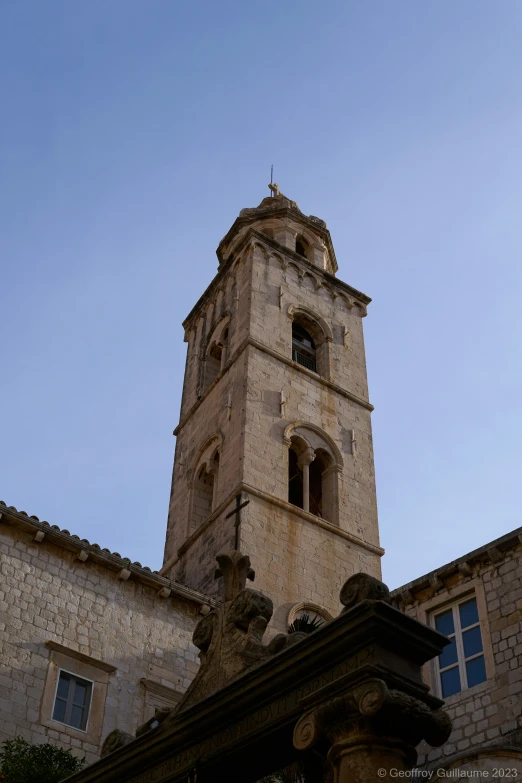 a view of an old tower on a clear day