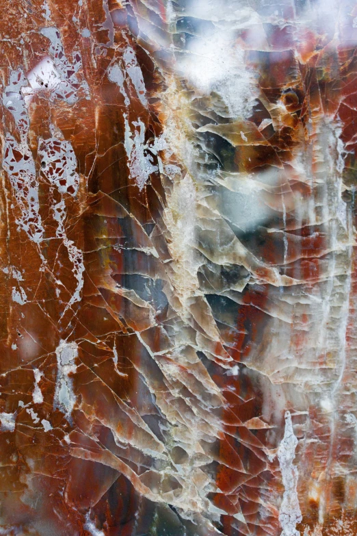 a close up view of a wall with red, white and blue paint