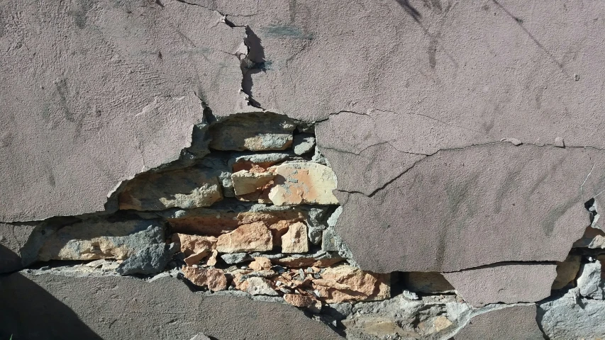 a rock formation on a wall in the desert