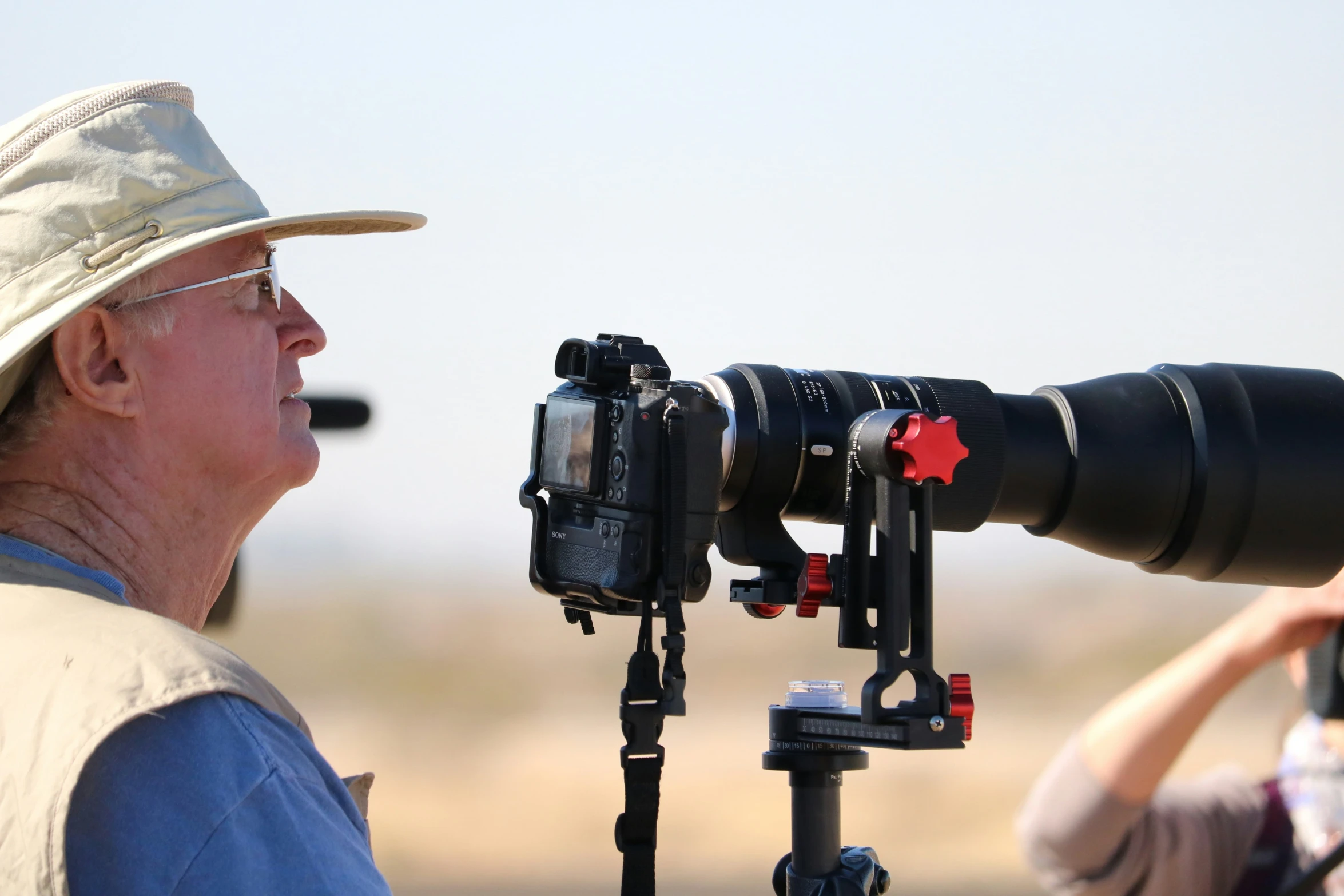 a pographer with an old camera next to his camera