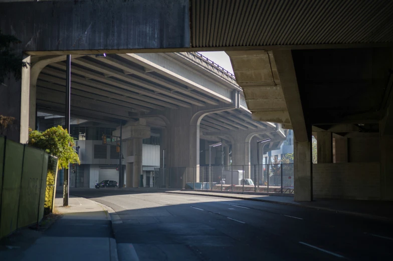 a po taken under a bridge showing a street