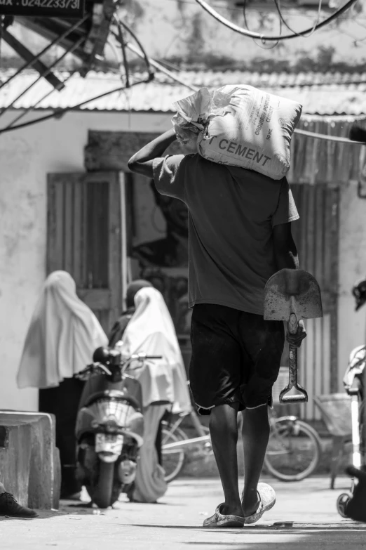 a black and white po of two men walking down the street