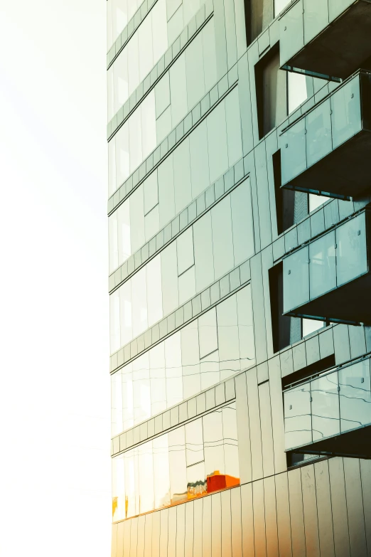 a tall building has white paint and windows