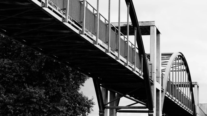 the silhouette of an arch and stairs is shown