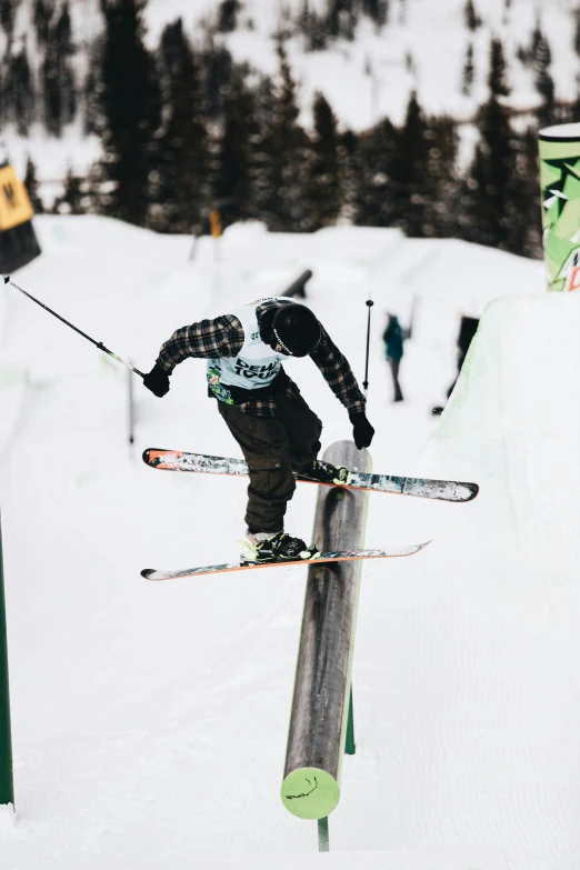 a person is jumping off the ski jump