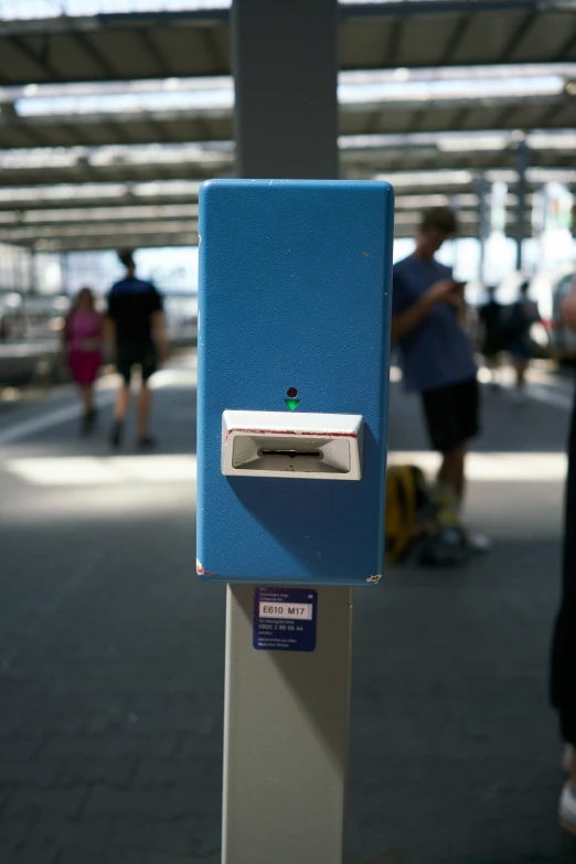 a blue, paperless toilet sitting on top of a blue counter